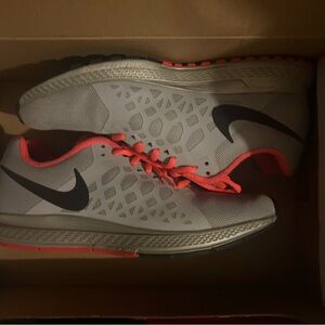 Gray and pink Nike sneaker